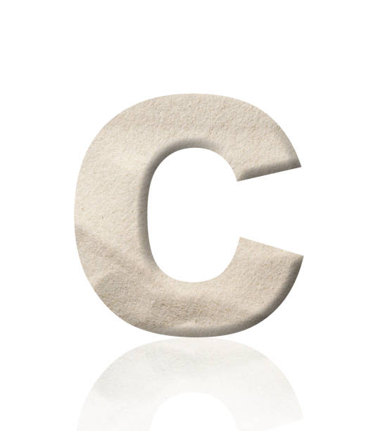 istock Isolated shot of three-dimensional sand alphabet letter C on white background 1941282037