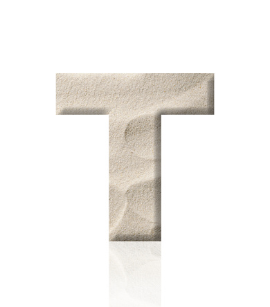 Close-up of three-dimensional sand alphabet letter T on white background.