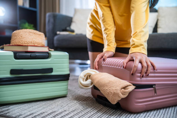 istock Preparation travel suitcase at home 1941289279