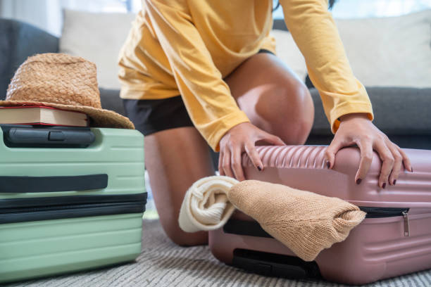 istock Preparation travel suitcase at home 1941289303