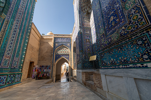 JUNE 24, 2023, SAMARKAND, UZBEKISTAN: Shah-I-Zinda memorial complex, necropolis in Samarkand, Uzbekistan. UNESCO World Heritage, blue sky with copy space for text