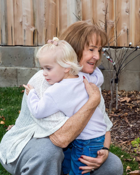 istock Grandmother hugging granddaughter 1941306596