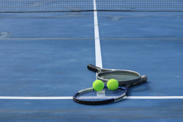 istock Close up view tennis ball with racket 1941317573