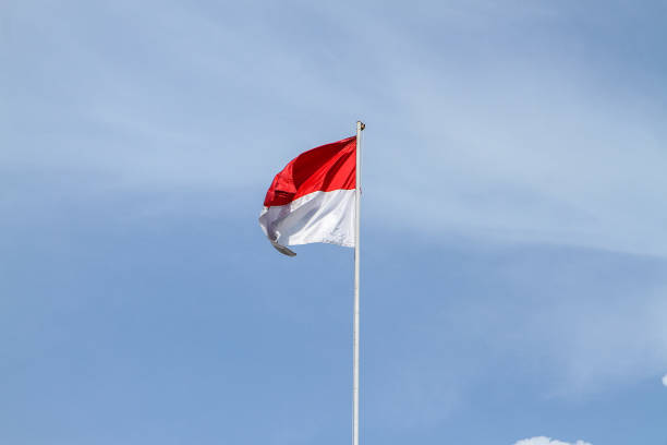 istock Indonesian flag against blue sky 1941331592