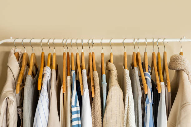 istock Hanger with neutral beige and white clothes on a white background. 1941362397