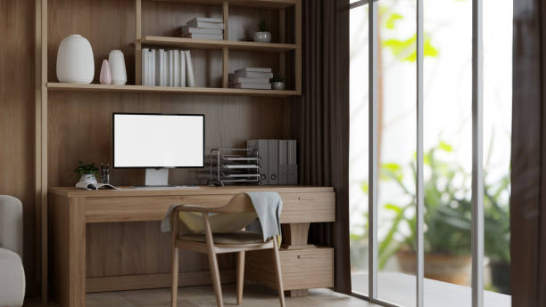 istock Interior design of a modern private office or home office with a computer mockup on a wooden desk. 1941406619