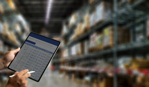 istock Warehouse management engineer holding tablet management dashboard Electronic inventory management concept 1941406915