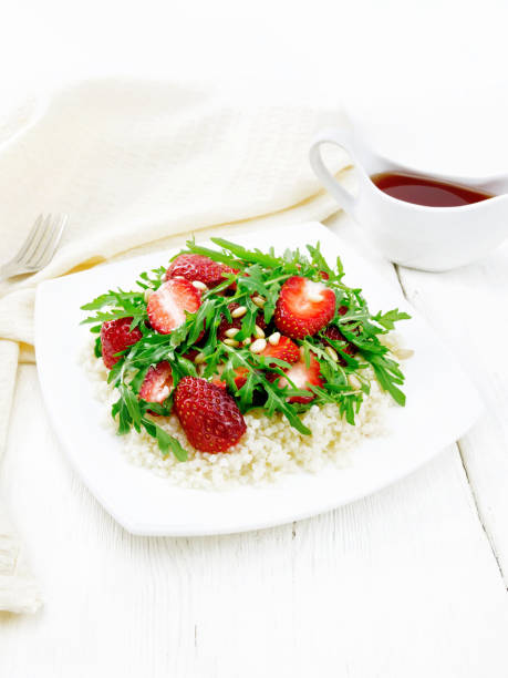 salad of strawberry and couscous on light wooden board - cedrine imagens e fotografias de stock