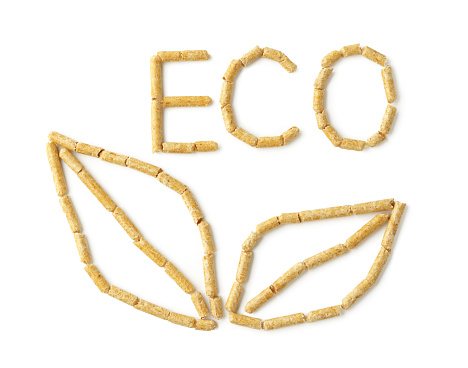 Wood pellets formed in word 'ECO' isolated on white background close up