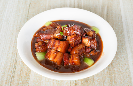 Chinese Cuisine: Braised Pork on table.