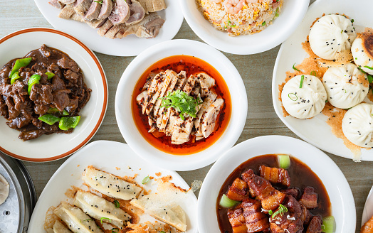 Table top of variety of Chinese dishes.