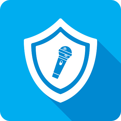 Vector illustration of a shield with microphone icon against a blue background in flat style.