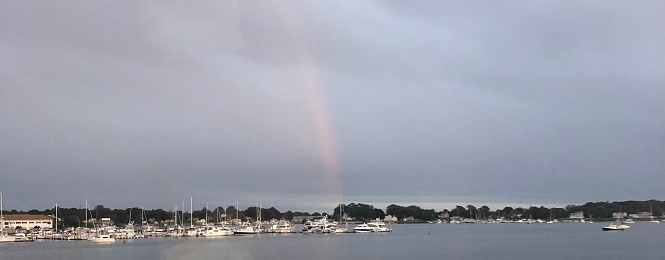 Boats on the water in Connecticut. Rainbow.