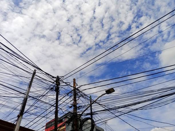 istock Several electric current cables with a beautiful view of the sky 1941587852