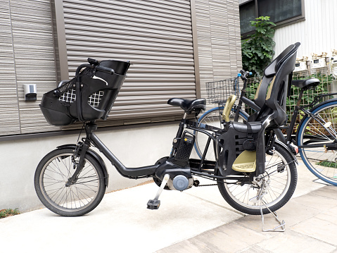 Electrically assisted bicycle with child seat