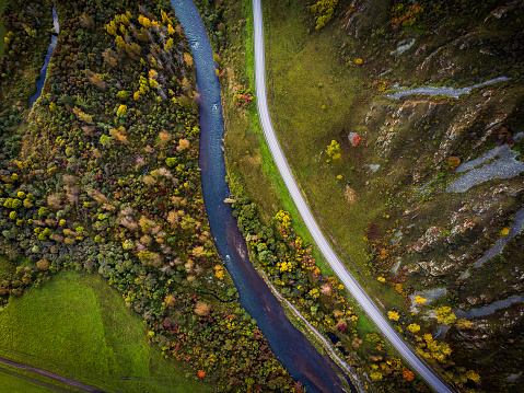 Directly above shot of stream and road passing through Altai mountains, Siberia, Russia