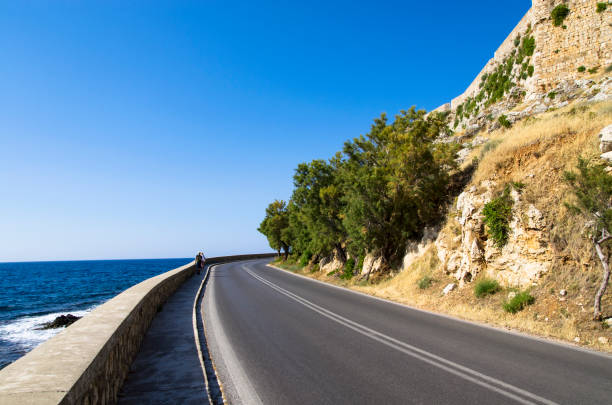 istock Car road on the seashore, landscape 1941643180