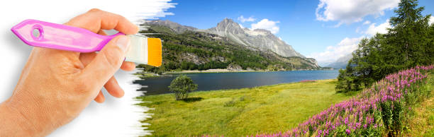 Landscape around Sils Lake on upper Engadine Valley (Switzerland - Europe) - concept image with hand and brush.