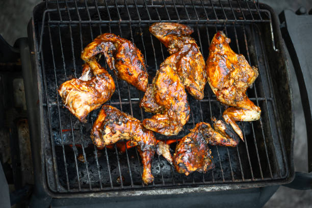 istock Barbeque pit chicken leg and thigh covered in BBQ sauce 1941654800