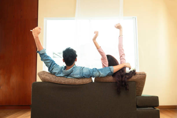 istock Happy couple and having romantic moment on couch 1941655333