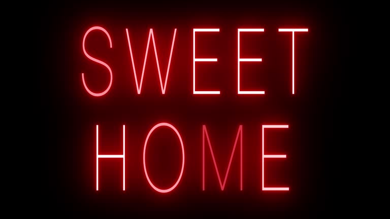 Glowing and blinking red retro neon sign for SWEET HOME