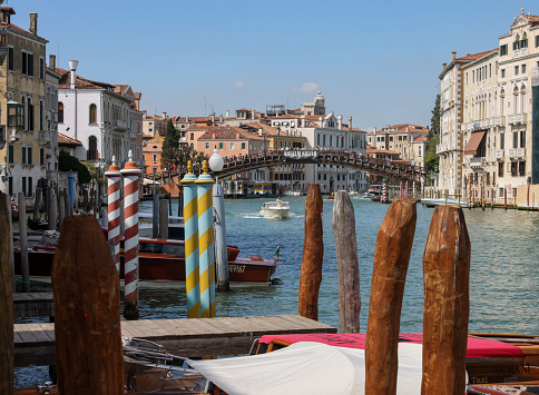 Traditional venetian lamppost and view of San Giorgio Maggiore island. San Giorgio Maggiore is one of the islands of Venice, lying east of the Giudecca and south of the main island group. Its Palladian church is an important landmark. It has been much painted, featuring for example in a series by Monet.