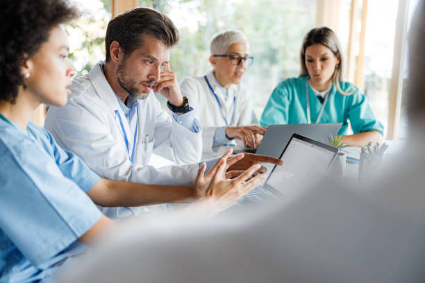 istock Doctors working on a computer during a meeting in the office. 1941701528