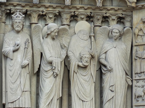 St. Denis on Facade of Notre Dame cathedral, Paris