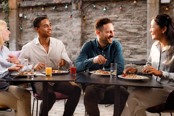 istock Happy business colleagues talking on a lunch in a restaurant. 1941734110