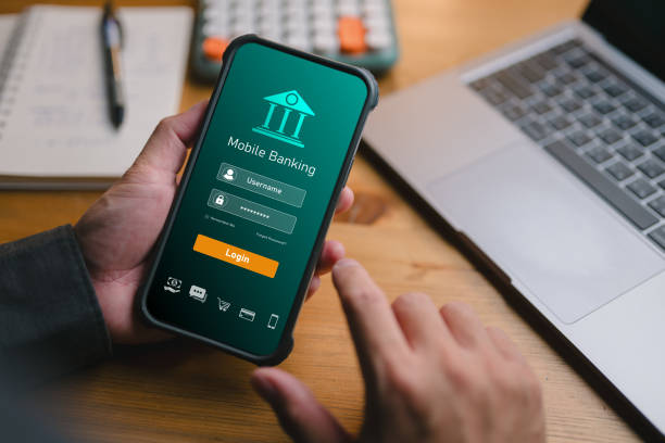 istock Businessman hands using smartphone to conduct online mobile banking, internet online banking, fintech, finance and investment, investing in stocks and mutual funds, retirement investment ideas. 1941755598