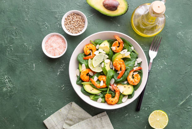 istock Salad with shrimps, avocado, spinach and almonds. Healthy eating. Diet. 1941832292
