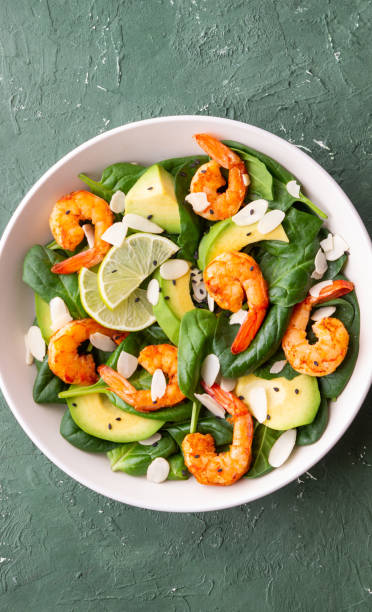 istock Salad with shrimps, avocado, spinach and almonds. Healthy eating. Diet. 1941832297