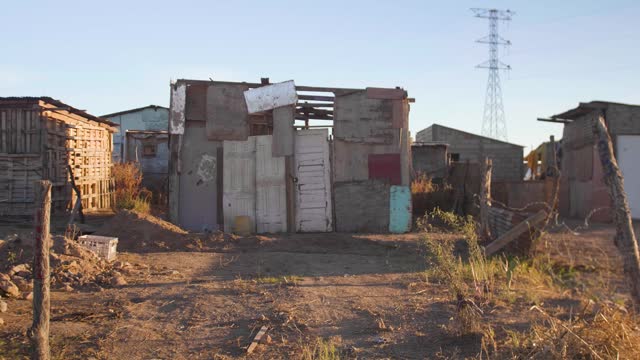 Poverty, inequality. Poor house in a low-income neighborhood. Third world. Abandoned house.