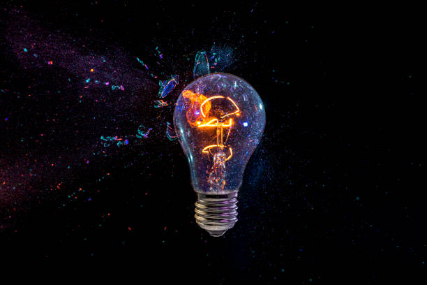 old bulb breaking into fragments on black