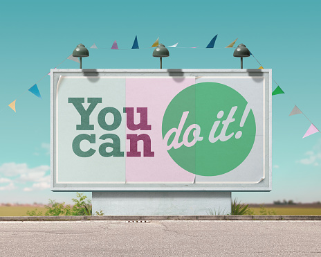 Inspirational and motivational advertisement on large vintage style billboard: you can do it!