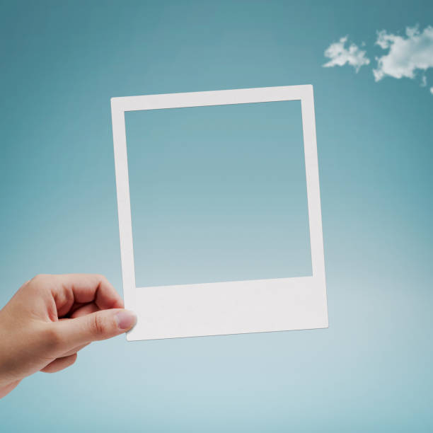 istock Female hand holding an instant picture 1941865838