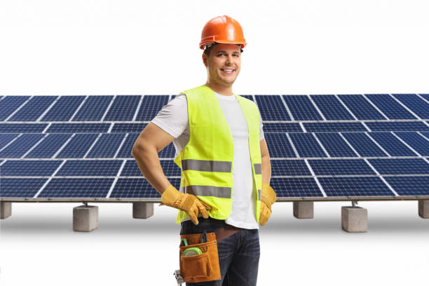 istock Construction worker with a helmet and tool belt on a solar farm 1941871648