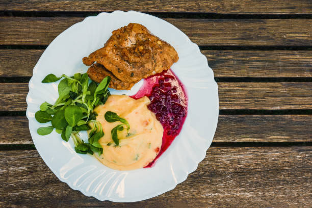 istock Homemade roasted turkey steak with sauce in a ceramic plate 1941883286