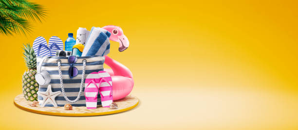 istock Beach bag with accessories and cute inflatable flamingo 1941901209