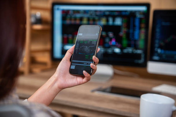 istock Young finance expert analyzing financial charts on smart phone 1941919485