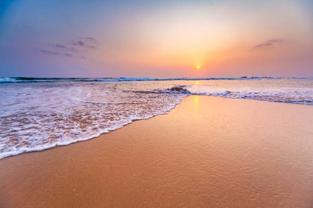 istock Golden Sunset Over Tranquil Beach in Hikkaduwa. 1941922667