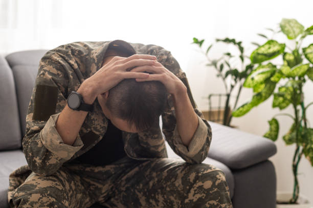 istock A distraught soldier covering his face, possibly suffering from shell shock or Post Traumatic Stress Disorder 1941922953