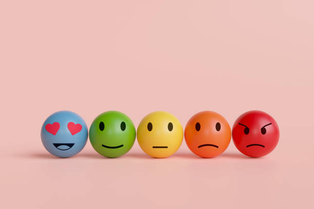 istock Five faces on a pink background. concept of evaluation, feedback, and degree of satisfaction score shows the emotion 1941930628