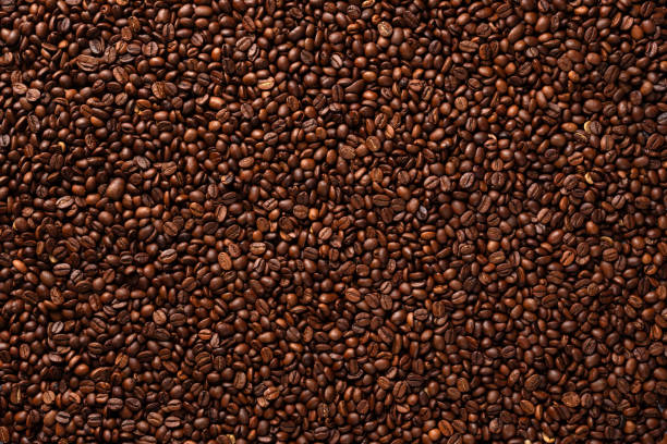 istock Top view of many roasted Arabica coffee beans. 1941931923