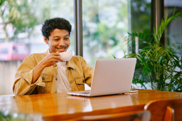 istock Businessman Owner working on laptop in cafe 1941943905