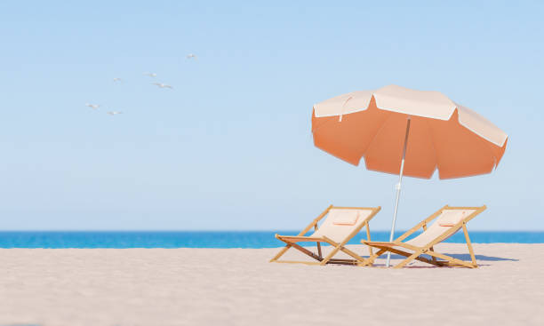 istock Beach Relaxation Scene with Sun Loungers and Umbrella 1941988270