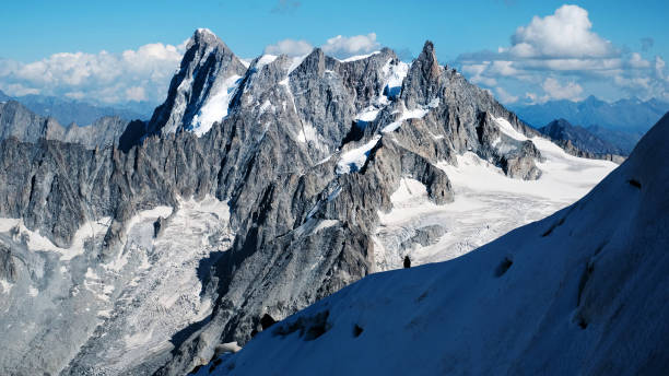 istock Alpinists Climbing The Montblanc Snowy Mountain 1941988312