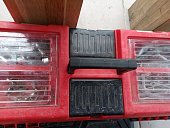 A large red hand tool storage box with many compartments for various items. Tools for repairing cars and other equipment.