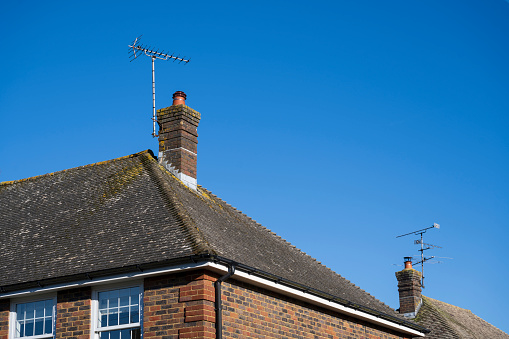 Pitched roof with chimney and television aerial