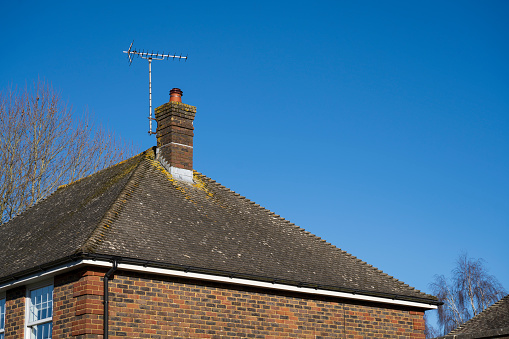 Tiled roof with clear blue sky